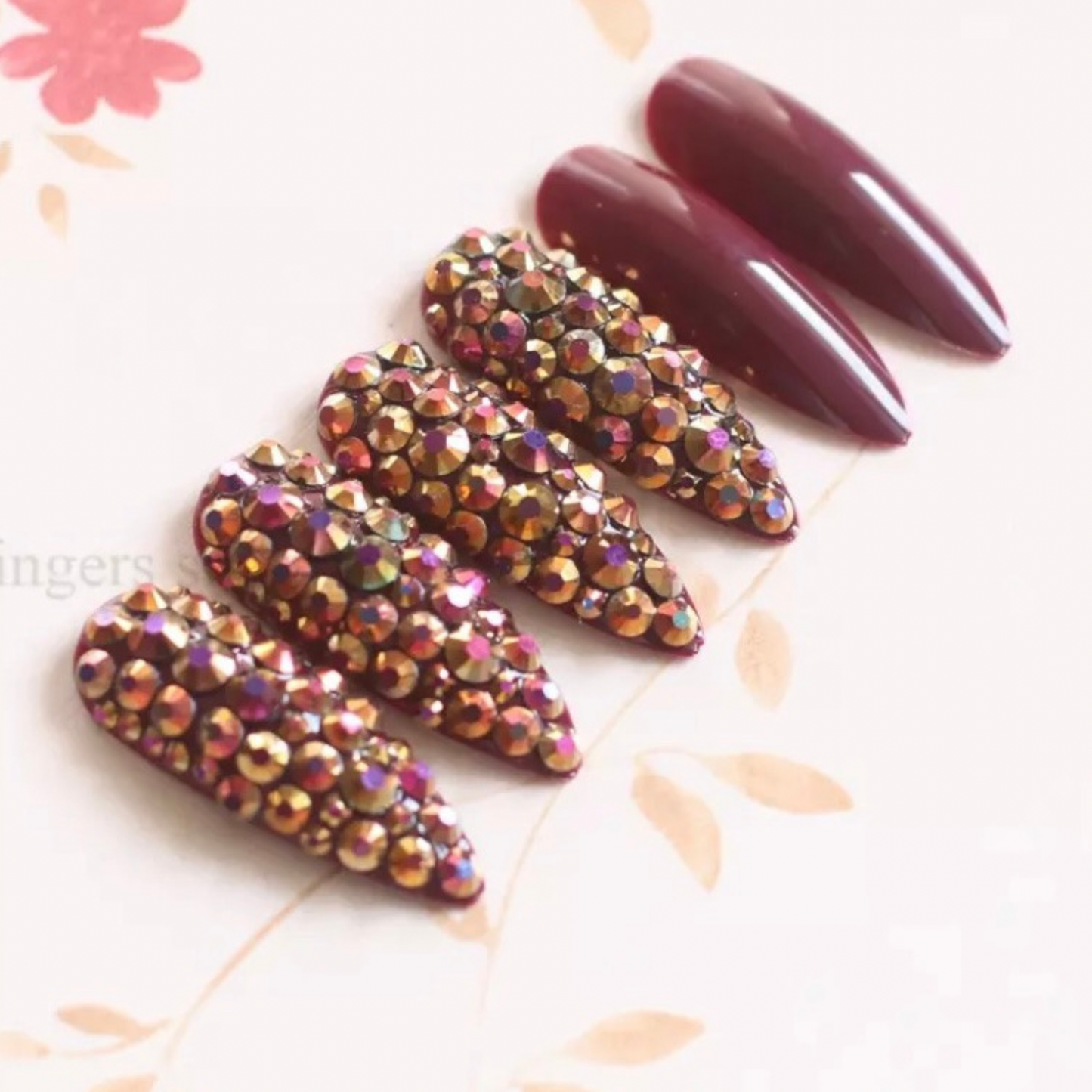 Burgundy Press On Nails with Blinged Out Accent Nails: Long Stiletto Shape for Glamorous Look